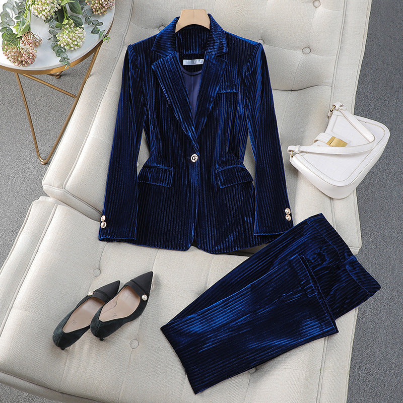Elegant women's two-piece blazer set with long blazer and tailored pants, ideal for professional wear.