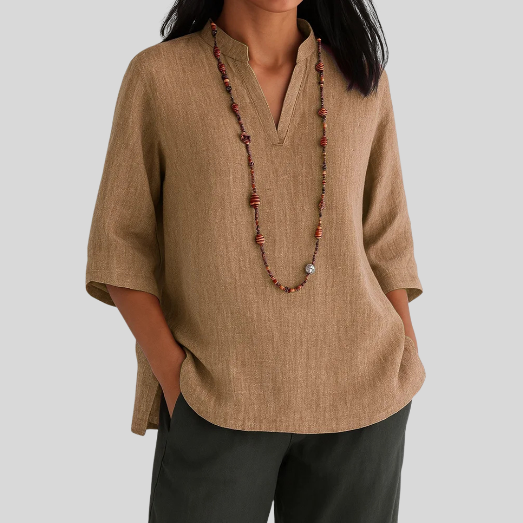Comfortable women's 3/4 sleeve V-neck blouse, relaxed fit, ideal for everyday casual wear.