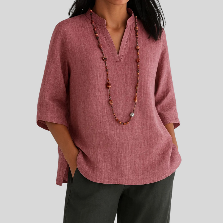 Relaxed fit women's V-neck blouse with 3/4 sleeves. Versatile top for office, casual, or spring style.