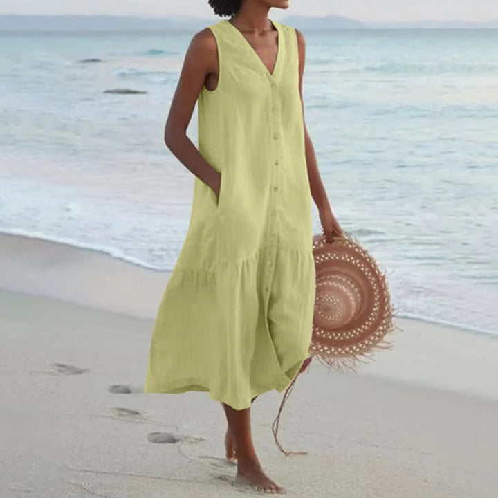 Flowy sleeveless V-neck summer dress for women. Casual button-front midi with a comfortable fit.