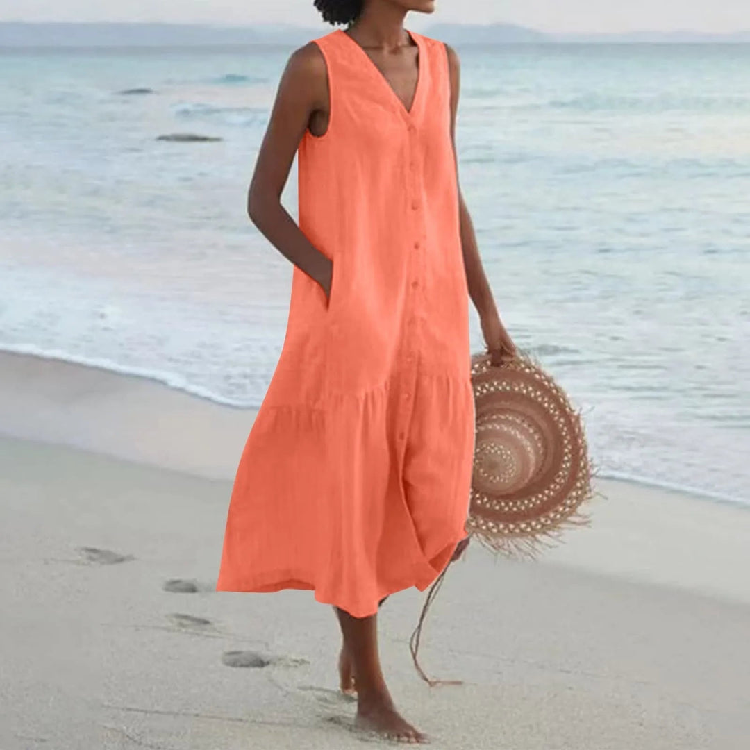 Stylish women's casual summer dress. V-neck, button-front, tiered midi design, great for daily wear.