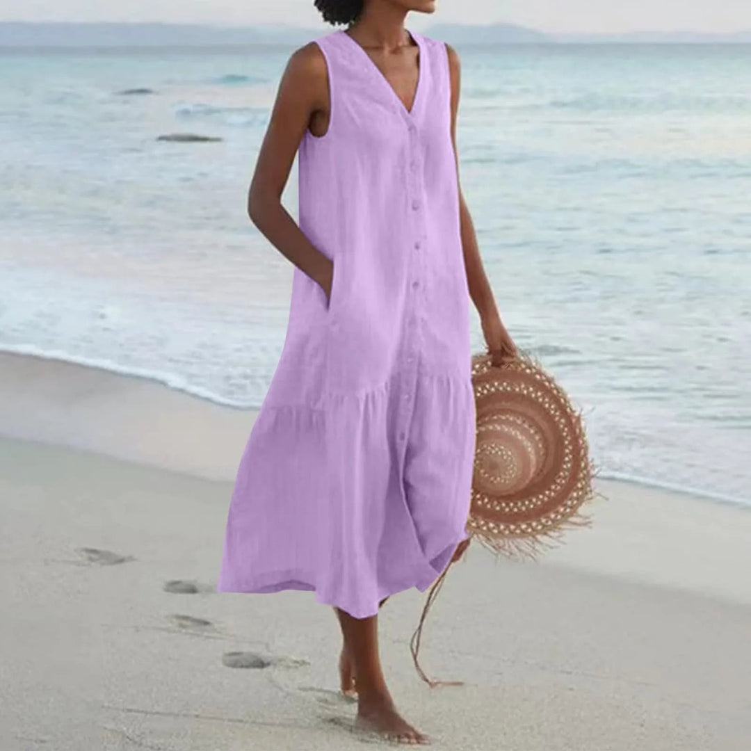 Lightweight women's summer midi dress, V-neck, button-front. Sleeveless and comfortable with pockets.