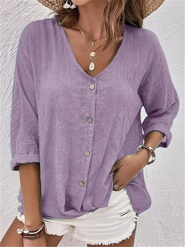 Women's versatile V-neck blouse with three-quarter sleeves and button-front, perfect for casual wear.