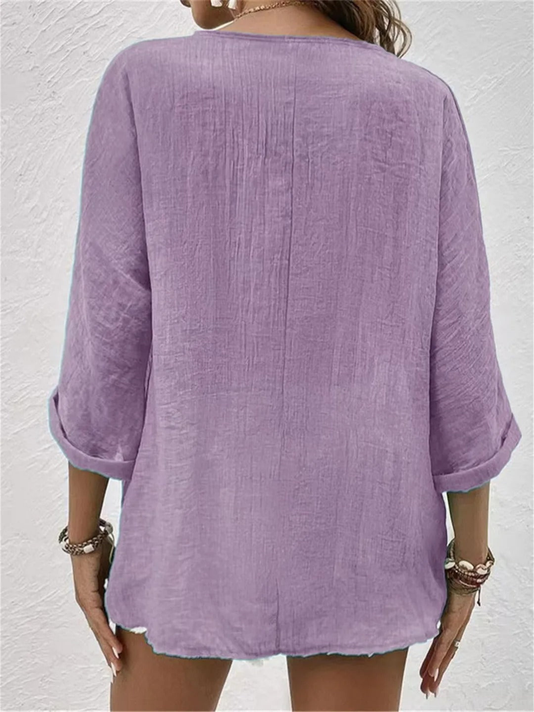 Soft women's V-neck button-up top, a relaxed fit shirt for comfortable and stylish casual outfits.