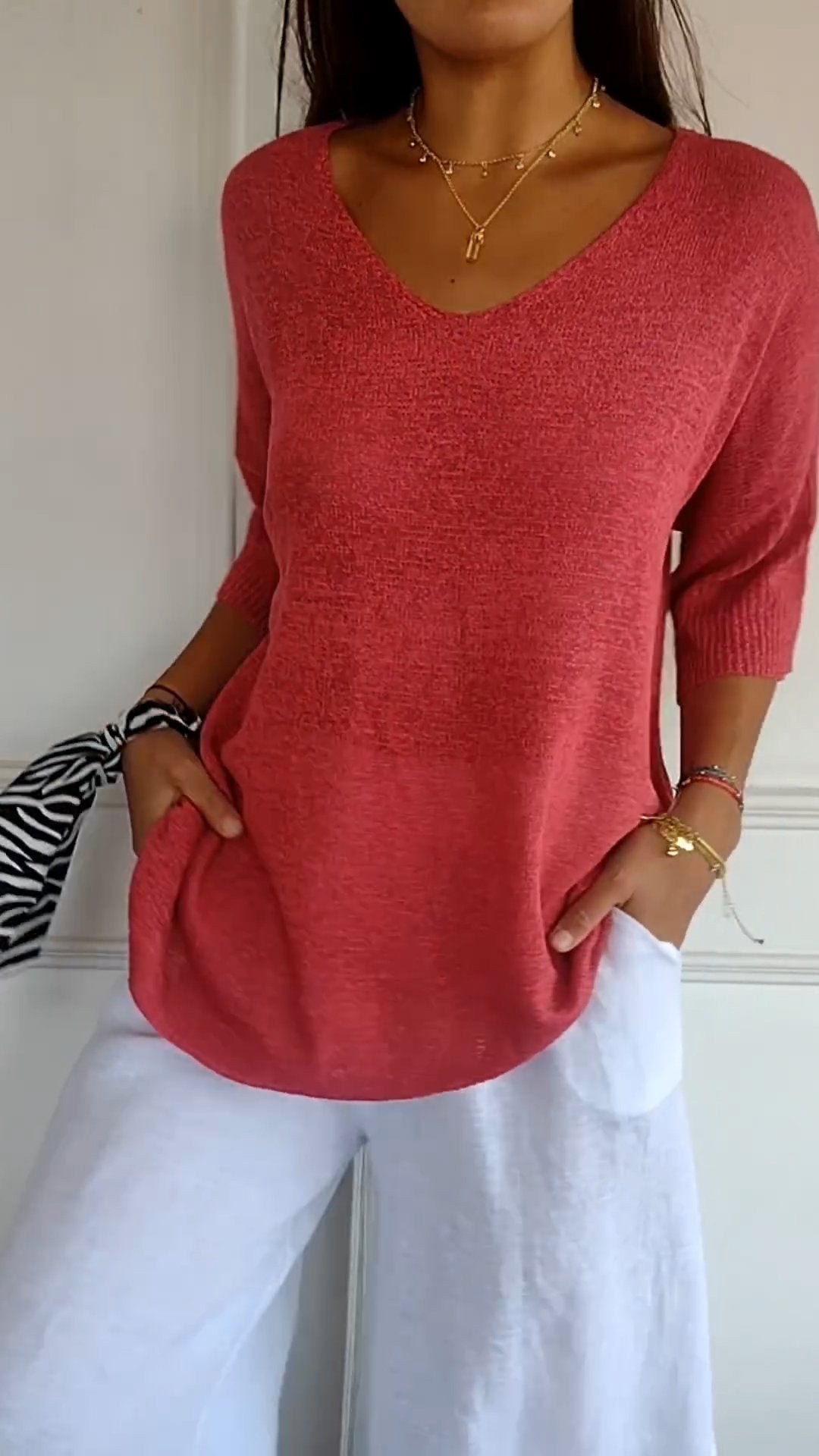 Women's casual V-neck top, relaxed fit, three-quarter sleeve. Perfect for everyday comfort.