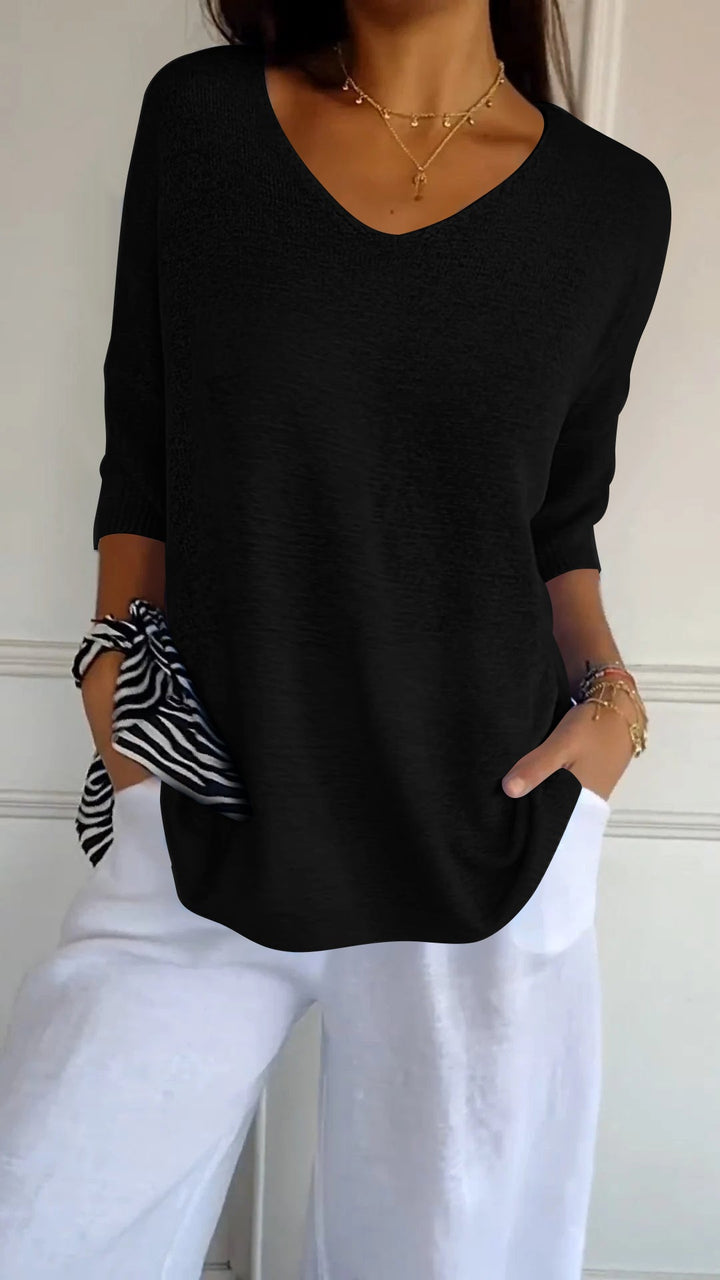 Comfortable women's relaxed fit V-neck top, versatile for layering in spring or fall.