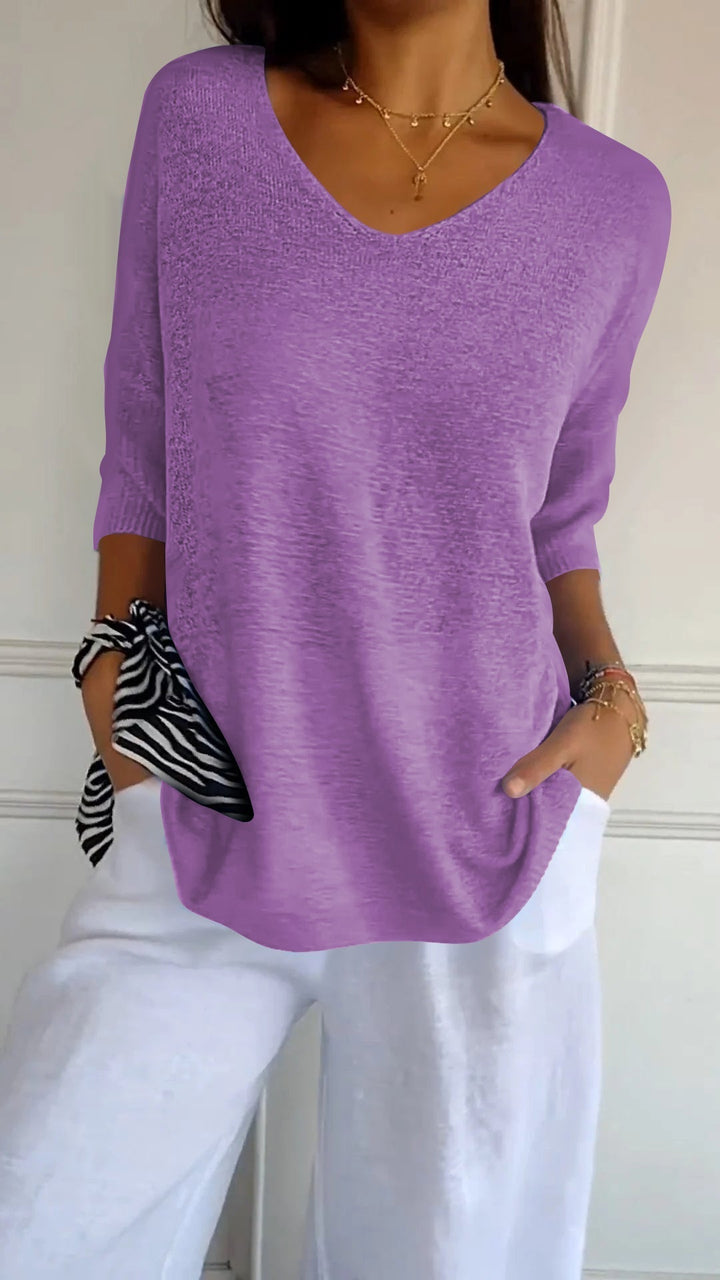 Soft women's V-neck top, relaxed three-quarter sleeve design. A must-have for everyday style.