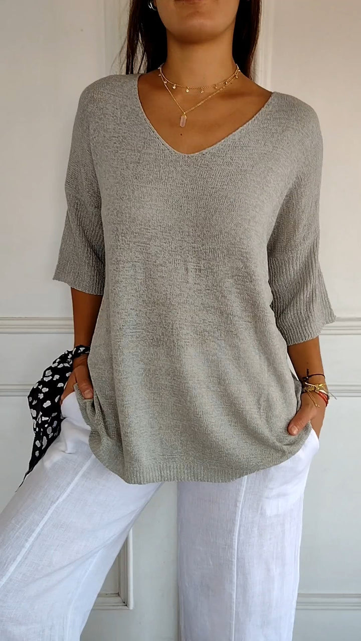Versatile women's V-neck top, comfortable loose fit, great for casual spring and fall outfits.