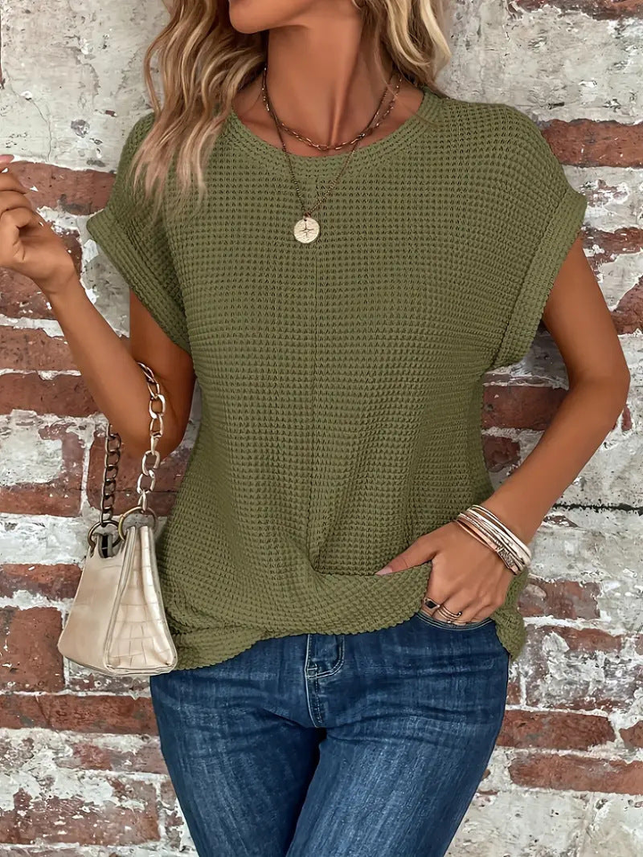 Stylish women's short sleeve waffle knit top, a comfortable and breathable choice for casual summer outfits.