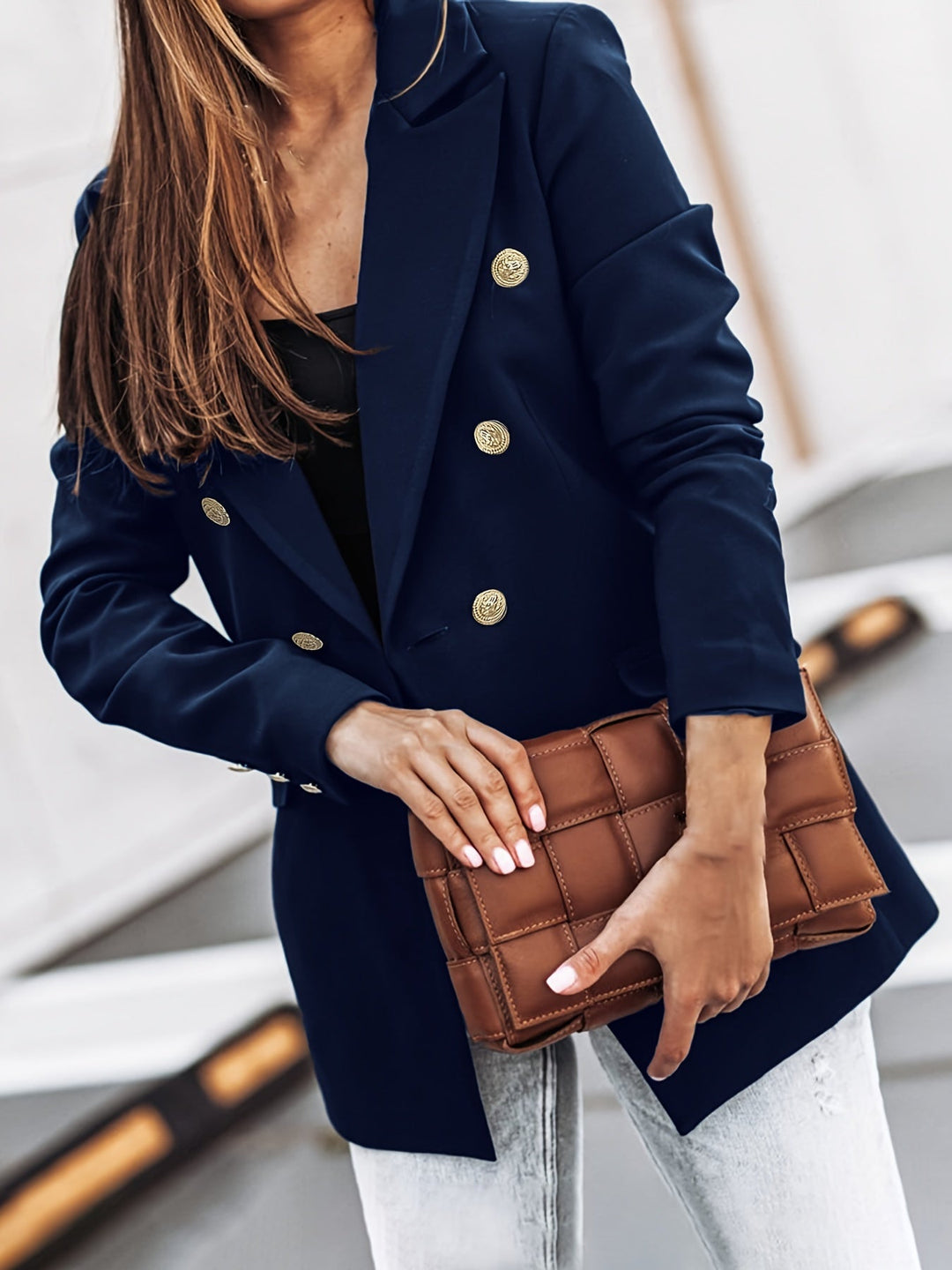 Fashionable women's casual blazer, featuring a polished design for a smart workwear look.
