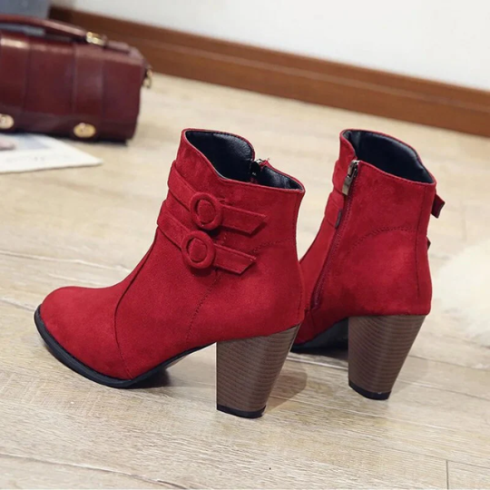 Women's chic black heeled ankle boots with side zipper and ornamental buckle, perfect for fall fashion.