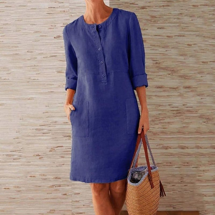 Women's chic button-front shift dress with side pockets, perfect for casual summer everyday wear.