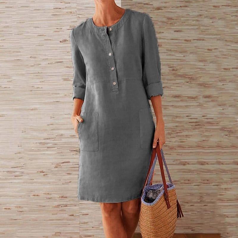 Stylish women's casual shift dress with button-front detail, 3/4 sleeves, and functional side pockets.