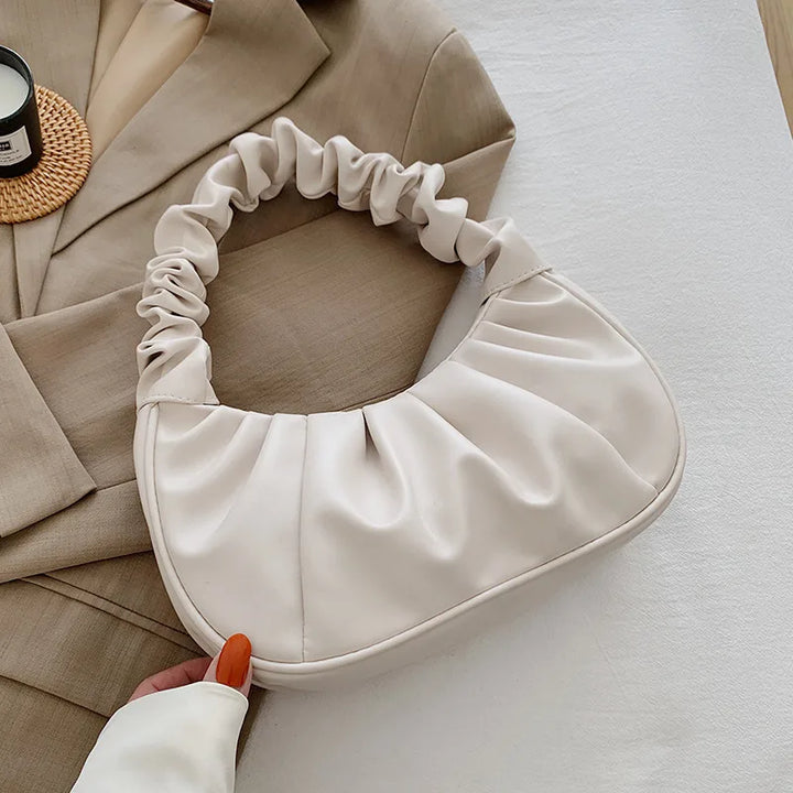 Studio shot of a Women's Chic Cloud Pleated Shoulder Bag, showcasing its soft PU leather texture