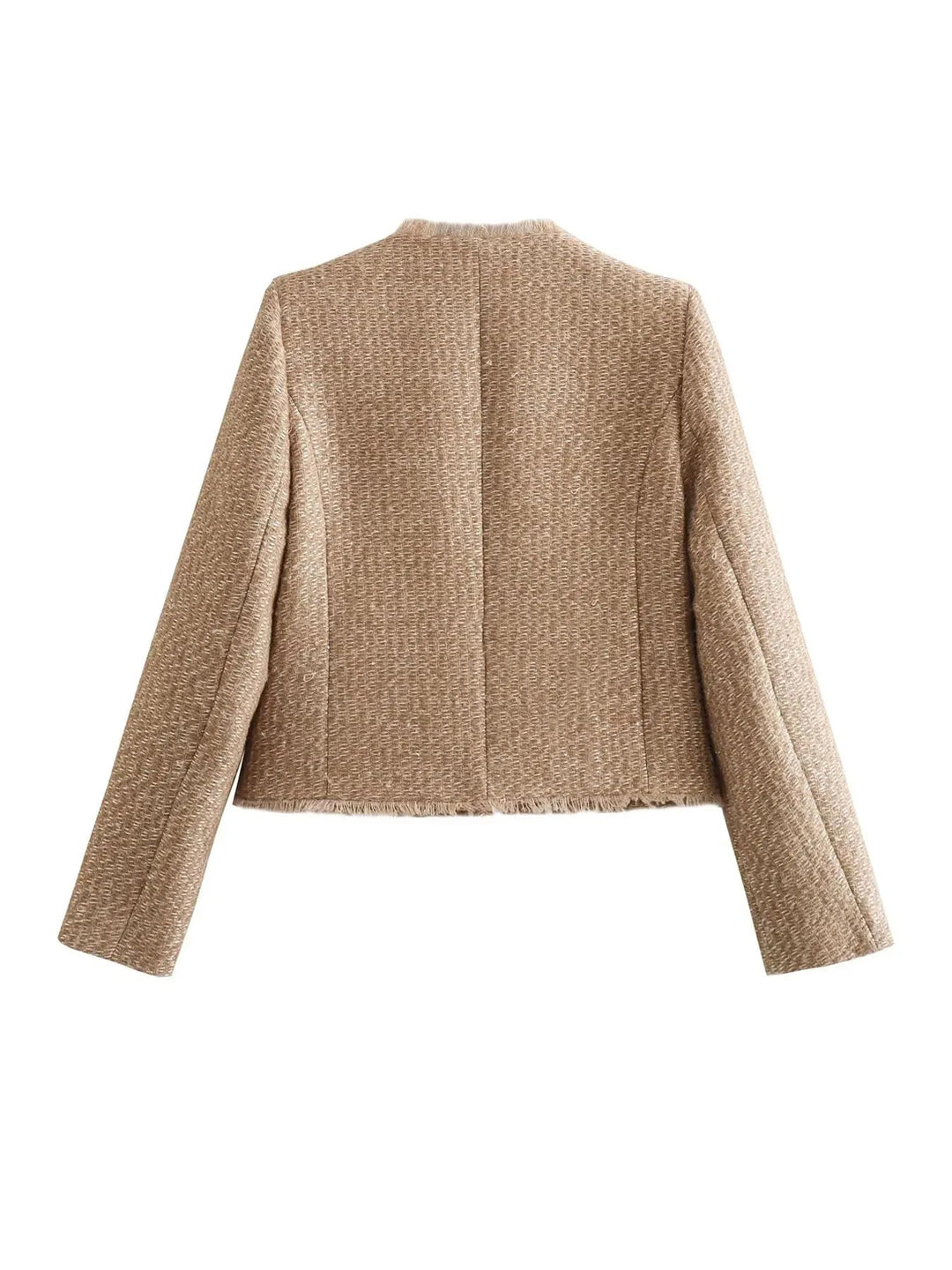 Close-up of a women's cropped tweed blazer, highlighting the intricate texture and chic design