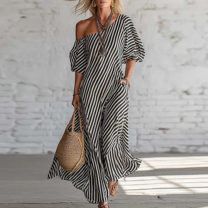 Beautiful women's striped one-shoulder dress with a stylish puff sleeve, perfect as a modern party dress.