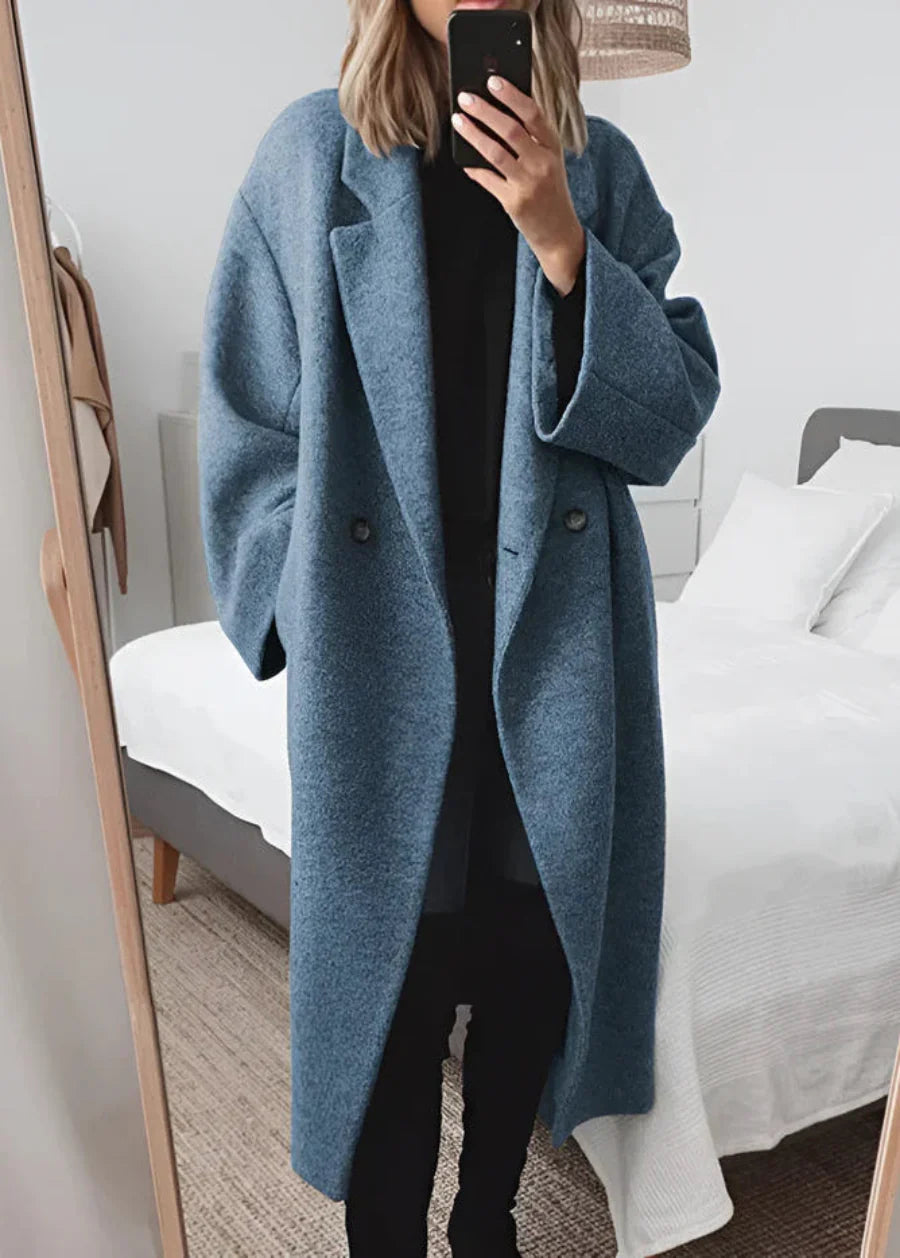 Women's elegant oversized long coat. Maxi design provides chic winter fashion and warmth for cold weather.