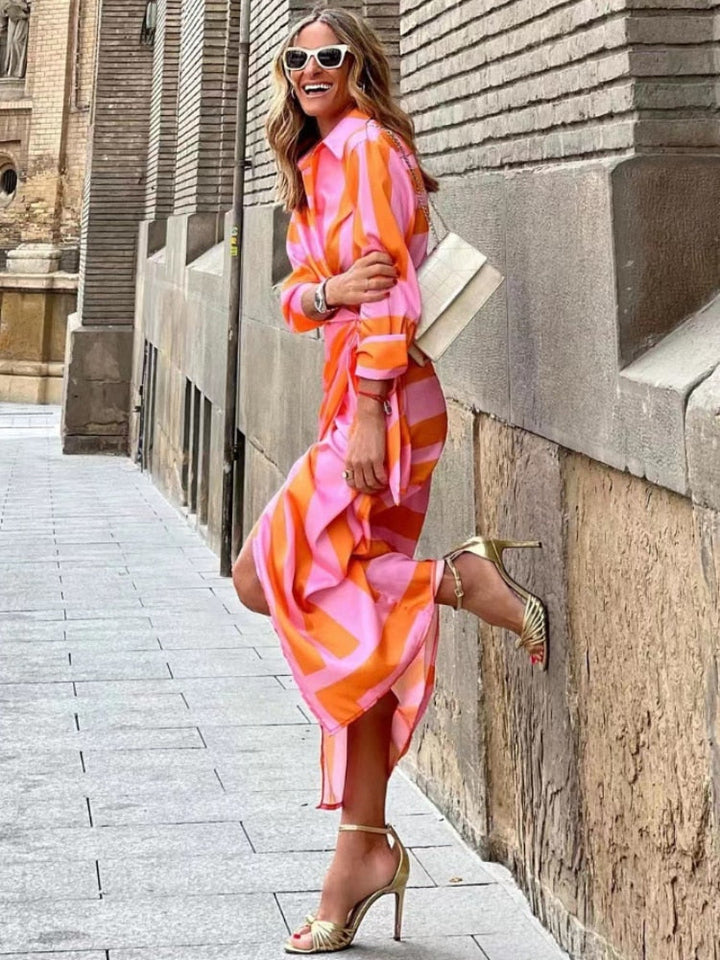 Collared women's wrap dress with a beautiful print, offering sophisticated style for any occasion.
