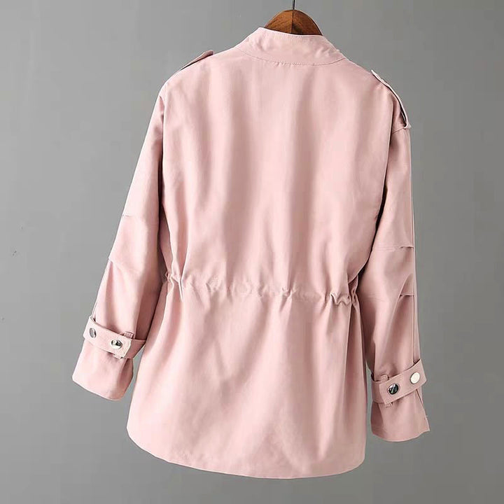 Stylish women's utility jacket in a neutral color, featuring multiple pockets and a full zipper.