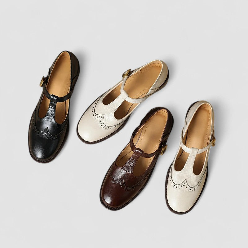 Pair of versatile women's black buckle strap mary jane flats, essential spring-summer footwear