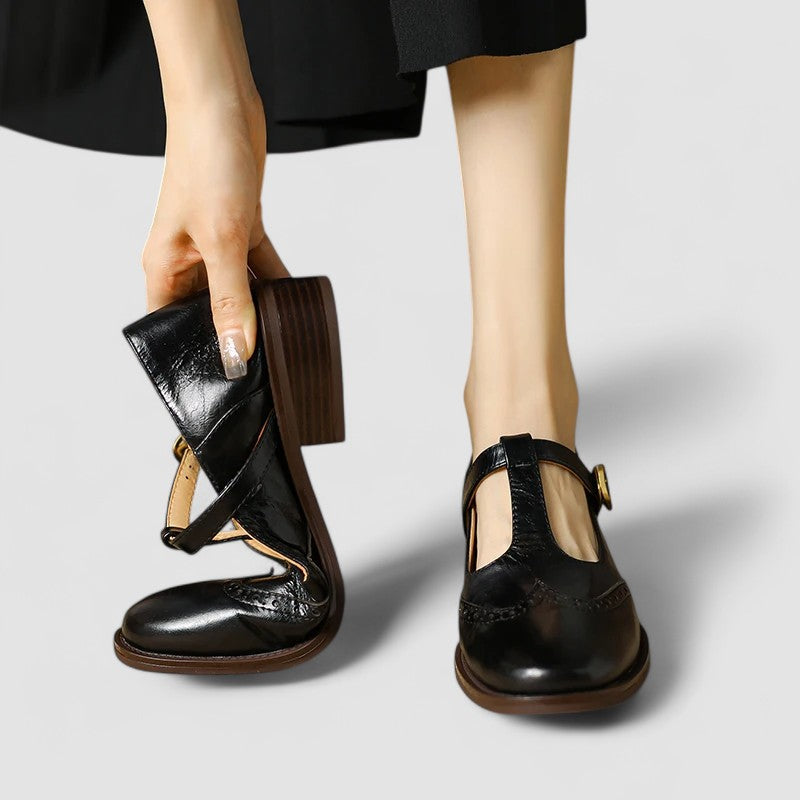 Close-up of the elegant buckle strap on women's classic black mary jane flats
