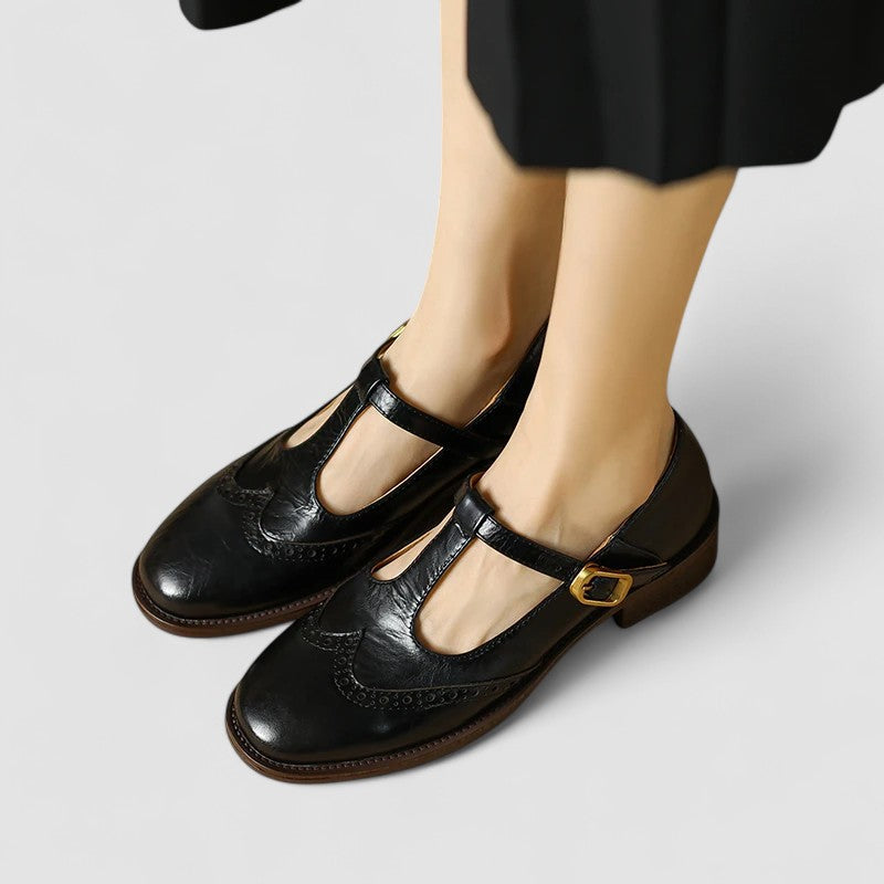Side view of women's black mary jane flats, showcasing the buckle and comfortable design