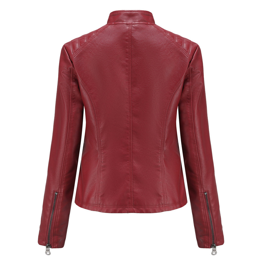 Edgy women's faux leather moto jacket with asymmetrical zip closure and collar detailing.