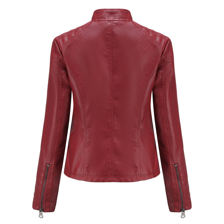 Edgy women's faux leather moto jacket with asymmetrical zip closure and collar detailing.