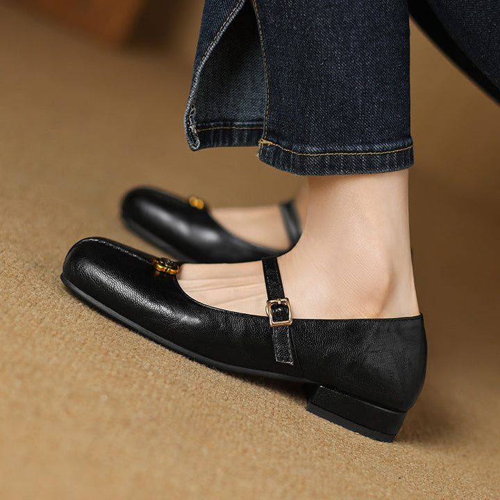 Close-up of a women's classic brown strap ballet flat, perfect for spring fashion