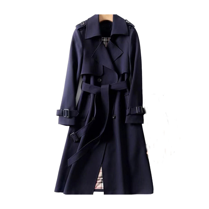 Front view of a women's double-breasted trench coat with wide lapels and belt, ideal for autumn.