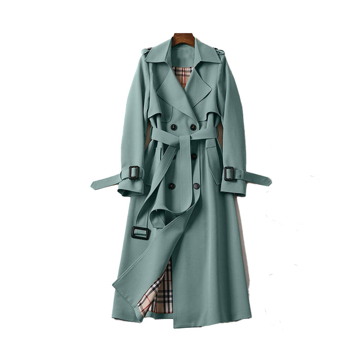 Full-length image of a women's double-breasted trench coat, a chic and essential autumn coat.