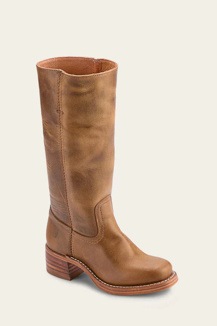Close-up of the distressed leather texture on women's vintage-look western mid-calf boots, perfect for casual wear