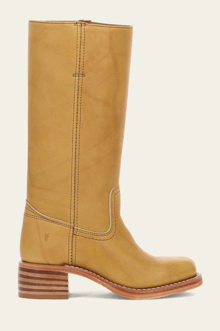 Pair of women's versatile brown western boots, mid-calf, with a classic silhouette and durable sole