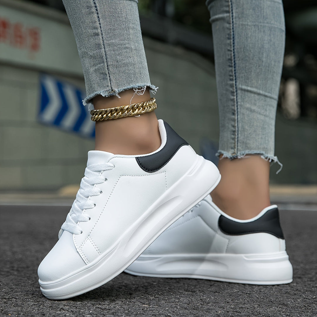 Versatile women's classic white sneakers. Ideal for walking, casual outfits & all-day comfort. Sporty chic footwear.
