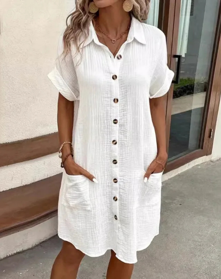 Women's collared button-down mini shirt dress. Short sleeve for casual, effortless summer style.