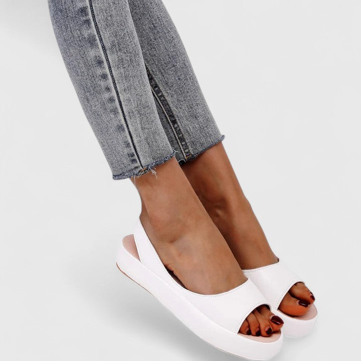 Fashionable women's sandals with advanced arch support technology for superior walking comfort.