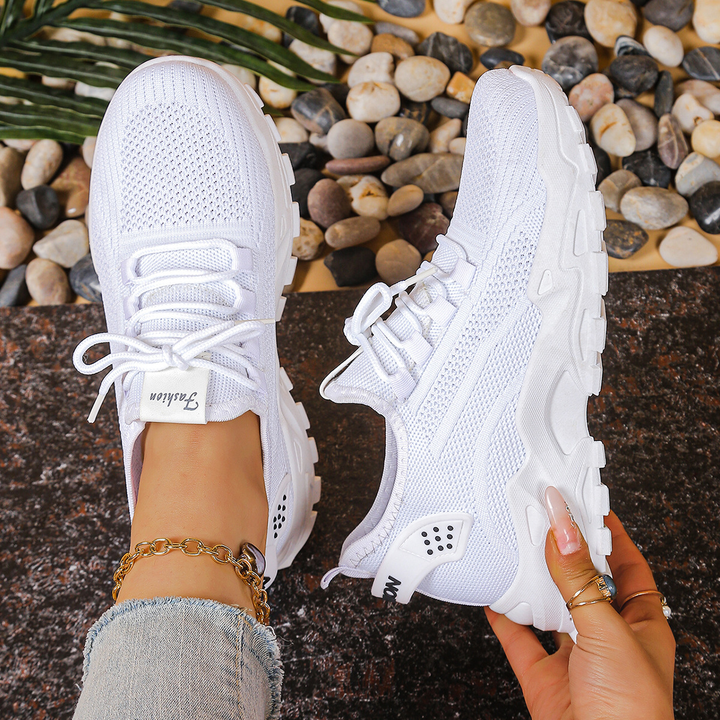 Womens comfort sneakers with arch support, shock absorbing sole, and wide toe box for foot pain relief.