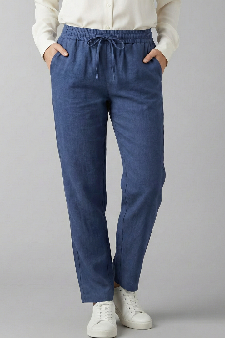 Close-up on fabric texture of women's comfortable trousers with elastic waist & side pockets.
