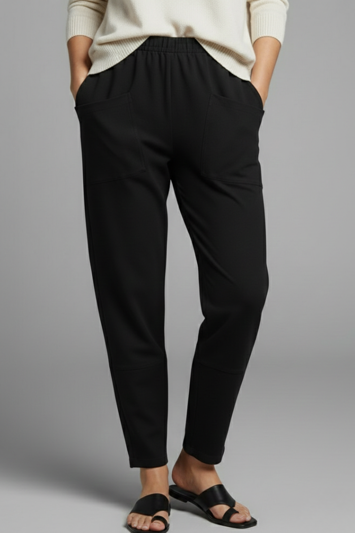 Side view: Ladies' comfortable bottoms with elastic waist, functional side pockets & stylish tapered leg.