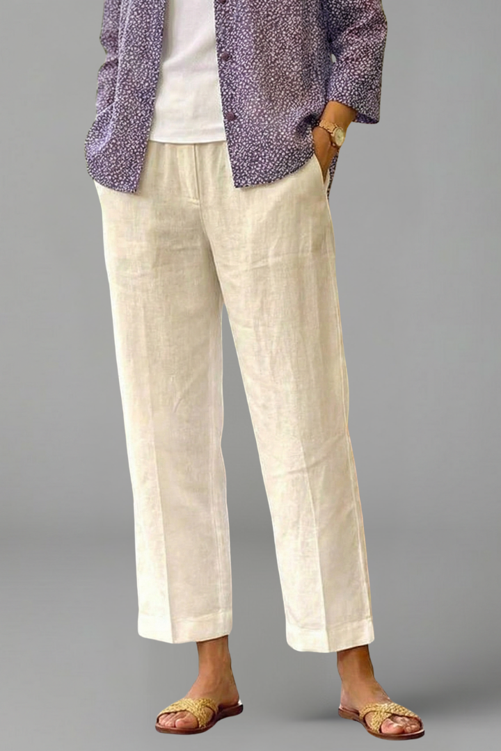 Woman walking in comfortable elastic waist straight leg trousers, showcasing comfort and movement.