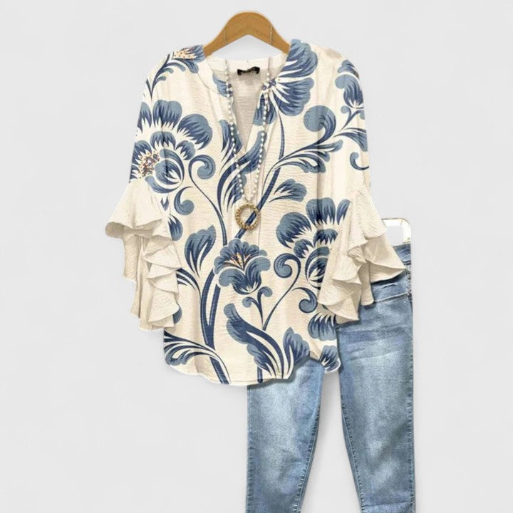 Women's comfortable floral print blouse with elegant ruffle sleeves. Perfect for spring & summer casual chic style.