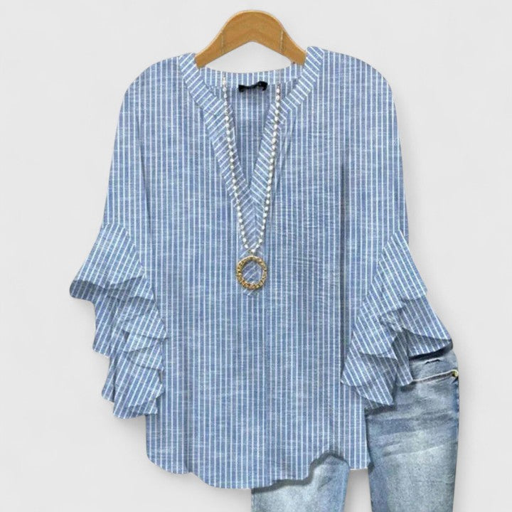 Versatile women's floral print blouse. Ruffle sleeves add elegance to this comfortable top for spring/summer fashion.