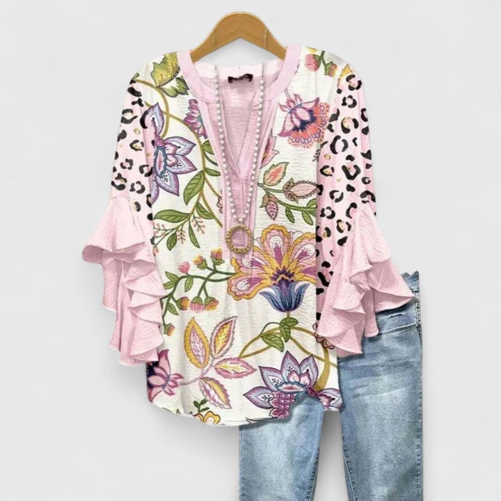 Lightweight women's floral blouse with elegant ruffle sleeves. Comfortable & versatile for spring/summer everyday style.