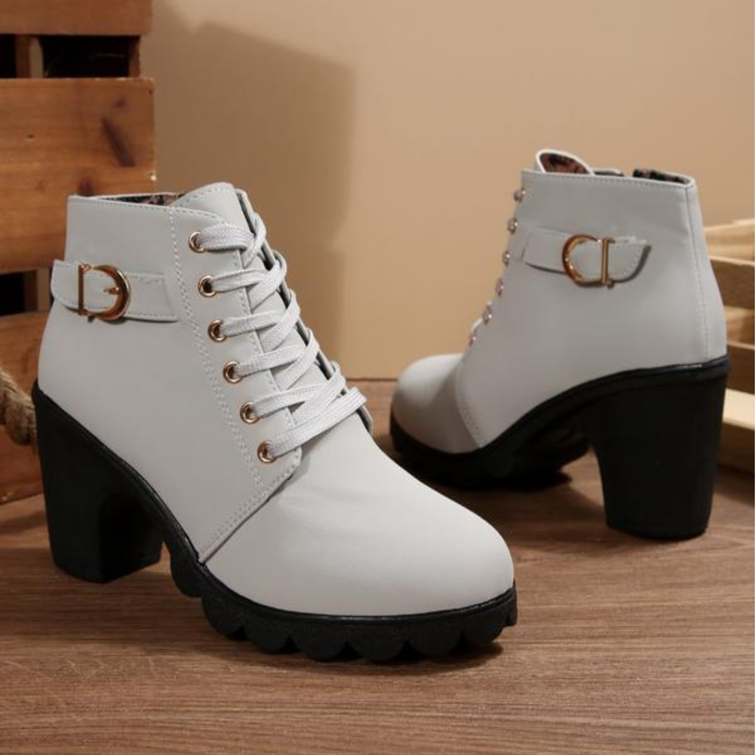 Back view of women's comfortable orthopedic boots with arch support, highlighting the stable block heel and ankle cut.
