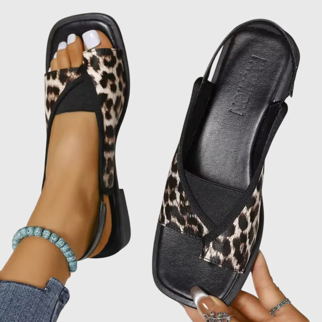 White women's comfortable orthopedic sandals. Stylish slip-on flat footwear for summer, offering arch support & casual elegance.