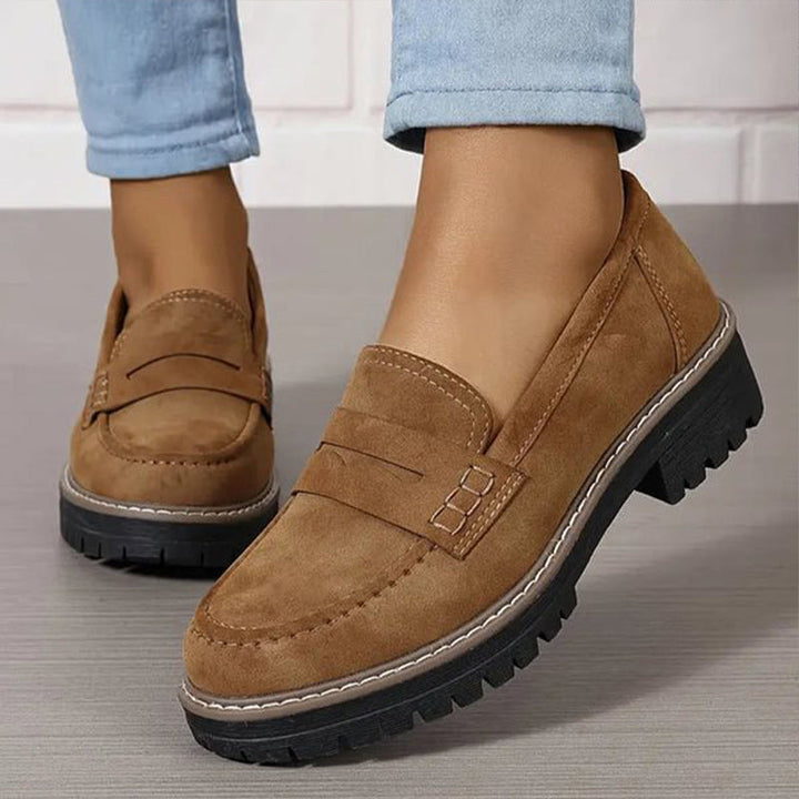 Women walking comfortably in elegant orthopedic loafers, featuring arch & cushioned support.