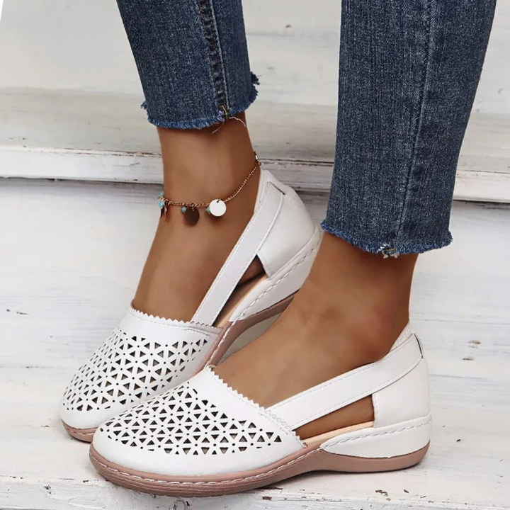 Arch support women's flats, comfortable slip-on shoes with a subtle wedge heel for all-day wear.