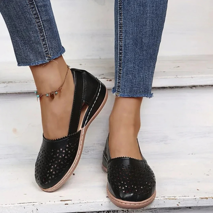 Stylish cutout women's orthopedic flats, comfortable slip-on shoes with arch support for daily comfort.