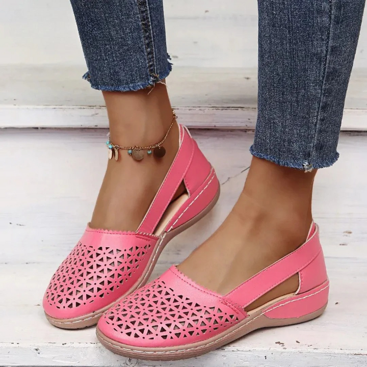 Comfortable women's slip-on orthopedic flats offering arch support and a lightweight design for summer.