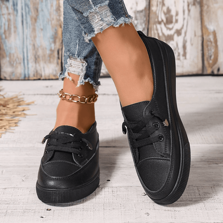 Orthopedic women's sneakers with superior arch support, designed for comfortable all-day walking & support.